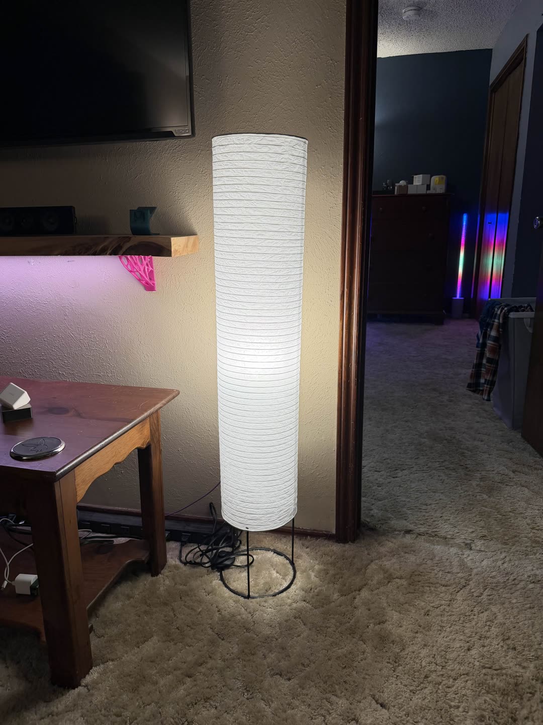 IKEA paper floor lamp lit warm white by a KAJPLATS RGBW bulb